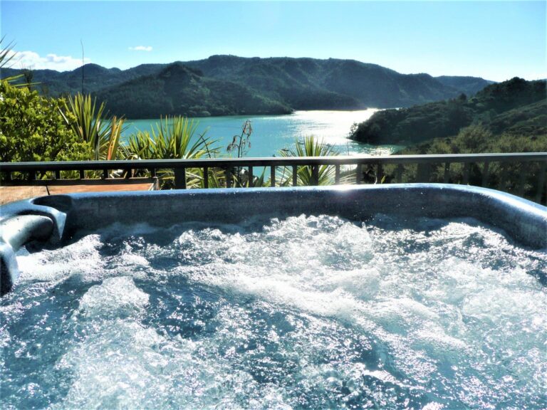 King's View Lodge spa, bubbling with background of Whangaroa Harbour and mountains beyond